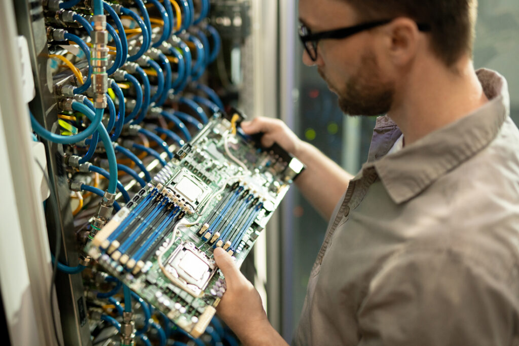 IT Specialist Checking Digital Flow Meter
